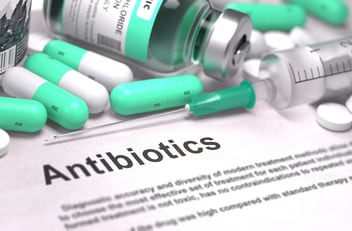 antibiotic pills laying on paper