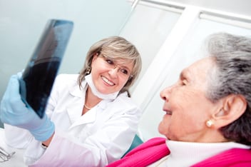 Dentist and older patient having a consultation