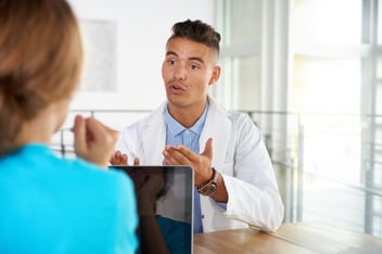 Dentist having a serious conversation.