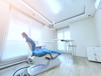 empty dentist chair in a dentist office