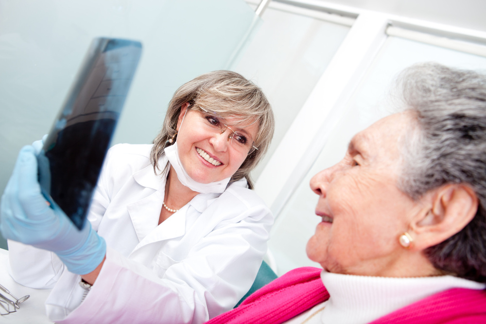 Dentist and older patient having a consultation