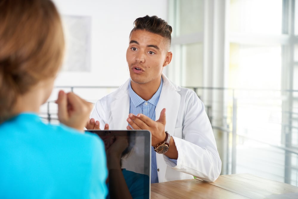 Dentist having a serious conversation.